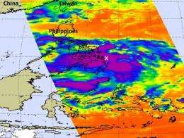 NASA sees large Tropical Storm Banyan stretched over southern Philippines
