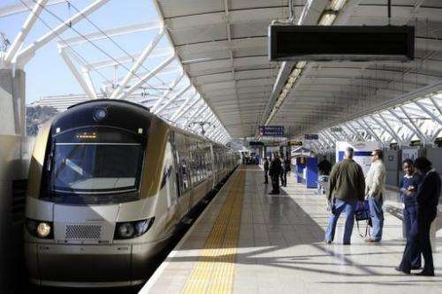 Passengers wait to board the Gautrain, Africa's first high-speed rail line in Pretoria today