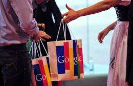 Patrons hold bags showing the Google logo