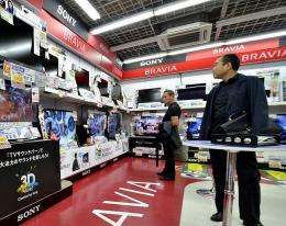 People look at Sony electronic products at an electrical shop in Tokyo on May 26