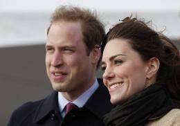 Prince William (L) and his fiancee Kate Middleton