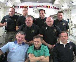 Shuttle astronauts bid farewell to space station (AP)