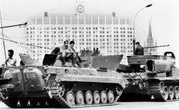 Soviet Army soldiers sit a top APCs in central Moscow on August 19, 1991, in front of the Russian White House
