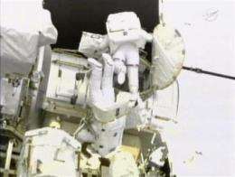 Spacewalking astronauts encounter bolt trouble (AP)