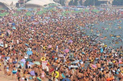 Sunbathers on a beach in Qingdao in eastern China's Shandong province