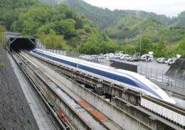 The Maglev (magnetic levitation) train speeds during a test run on the experimental track in Tsuru