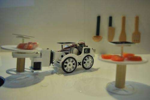 The robot car "Cooky" is designed to help the user cook various customized recipes.