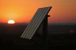 The sun sets on photovoltaic solar panels