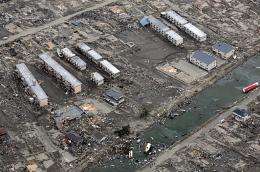 This aerial view taken during an AFP-chartered flight shows an area destroyed by the tsunami in Sendai