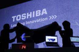 Toshiba is to shut three semiconductor factories in Japan as part of a reorganisation of its business