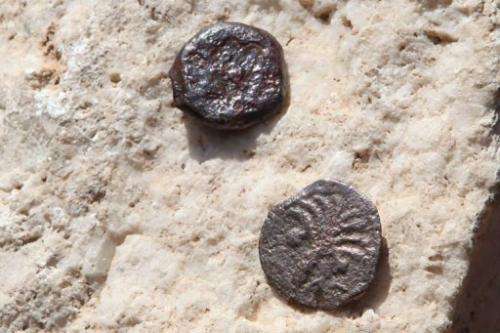 Two ancient bronze coins recently revealed in excavations