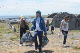 Uruguayan high school students pick up trash at Flores Island