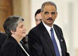 US Attorney General Eric Holder (R) and US Secretary of Homeland Security Janet Napolitano