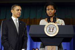 US First Lady Michelle Obama speaks before President Barack Obama