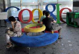 Visitors sit on a bench at a lobby of an office of Google Korea in Seoul