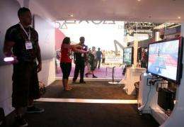 Visitors test the Sony Playstation Move at the 2010 E3 in Los Angeles