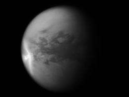 What caused a giant arrow-shaped cloud on Saturn's moon Titan?