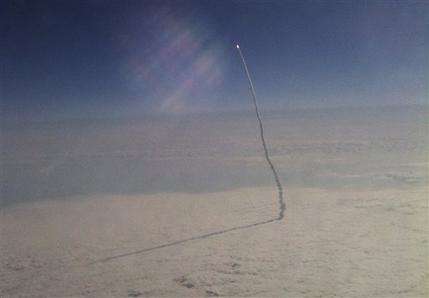 Woman's plane photos of space shuttle go viral (AP)
