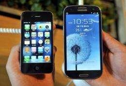 Apple's iPhone 4S (L) and Samsung's Galaxy S3 (R) are pictured
