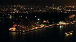 File photo shows the Sydney Opera House with its lights turned off to mark Earth Hour on March 26 last year