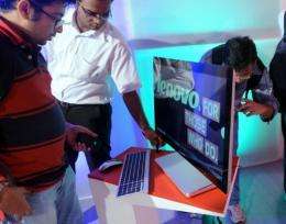 Journalists inspect the new Lenovo Ideacentre A720 at a launch function in Mumbai