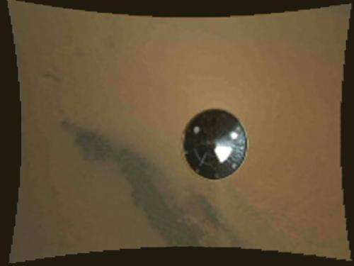 Mars rover Curiosity beams back images showing its descent