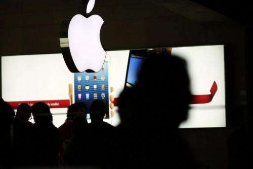 People walk through the Apple retail store in Grand Central Terminal on December 10, 2012 in New York City.