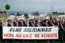 Protesters hold banner reading: "In solidarity, no to the shale gas" in France in 2011