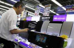 Sony's loss grows, cuts earnings forecast