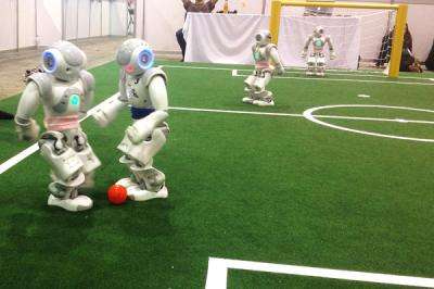 University of Texas at Austin team wins robot soccer world championships in 2 divisions