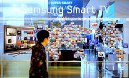 A South Korean man walks past a Samsung Smart TV advertisement