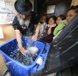 Christopher Toole teaches children about aquaponics