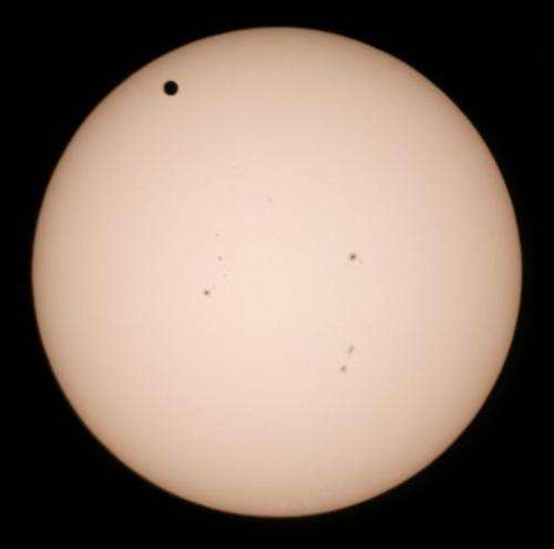 Eyes turn skyward as Venus travels across the sun