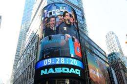 Facebook co-founder Mark Zuckerberg is seen on a screen getting ready to ring the NASDAQ stock exchange opening bell