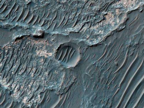 Latest from Mars: Massive polar ice cliffs, northern dunes, gullied craters