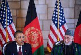 US President Barack Obama (L) speaks before signing a strategic partnership agreement with Afghan President Hamid Karzai