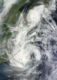 NASA satellites see Tropical Storm Saola and Typhoon Damrey arm-in-arm near China
