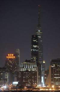 File photo shows New York's Empire State Building turn off its tower lights in March 2010