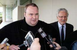 Megaupload boss Kim Dotcom leaves court after he was granted bail in the North Shore court in Auckland in February