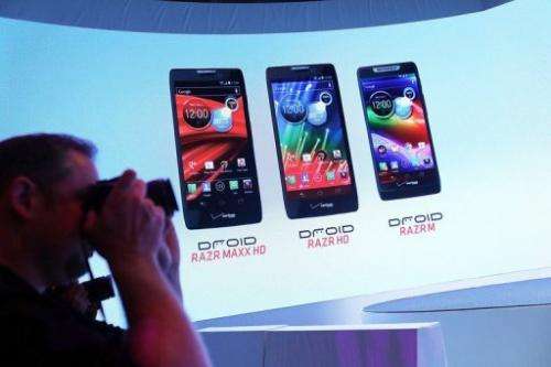 Members of the media attend the launch of three new Motorola smartphones under its Razr brand