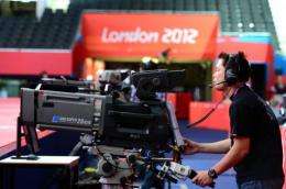 A cameraman tests his equipment one day before the start of the London 2012 Olympic Games