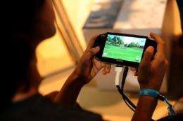 A child plays a handheld video game