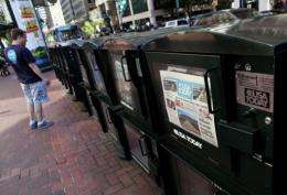 A copy of USA Today is displayed in a newspaper vending rack in 2009