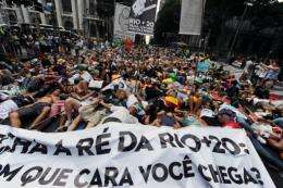Activists lie in the street during a demonstration against the forest code and the Belo Monte Hydroelectric plant
