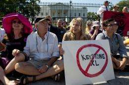 Actress Daryl Hannah sits in front of the White House in August during a protest against the Keystone XL pipeline