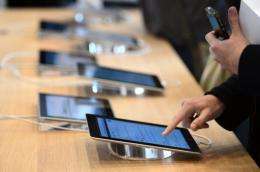 A customer uses a tablet during the inauguration of a new Apple store in Strasbourg, France, on September 15