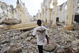 A Hatian man walks through the ruins of the Cathedral in Port-au-Prince in 2011