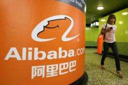 Alibaba.com said fourth-quarter net profit fell 6 percent from a year earlier