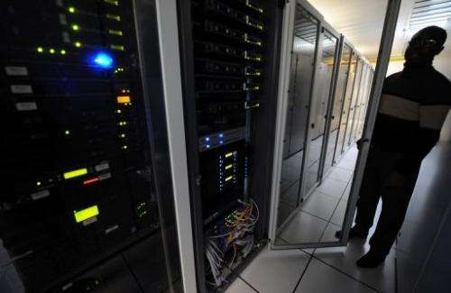 A man checks servers in a data center