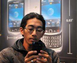 A man uses his Blackberry smartphone in Jakarta last week
